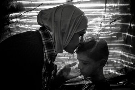 Ashley Gilbertson, ‘Amira Raslan conforts her son Aur, Berlin, 2016. The family fled Syria for safty in Germany in 2015’
