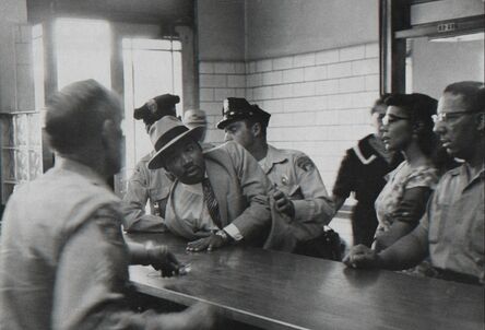 Charles Moore, ‘Martin Luther King Jr.is Arrested for Loitering Outside a Courtroom Where his Friend Ralph Albernathy is Appearing for a Trial. As His Wife Looks on, King is Sprawled Across the Police Desk’, 1958