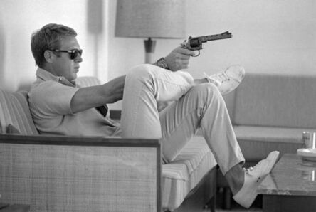 John Dominis, ‘Steve McQueen aims a pistol in his living room, California’, 1963