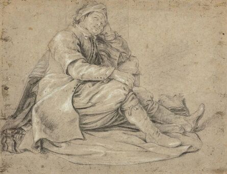 ‘A seated man resting his head in his hand’