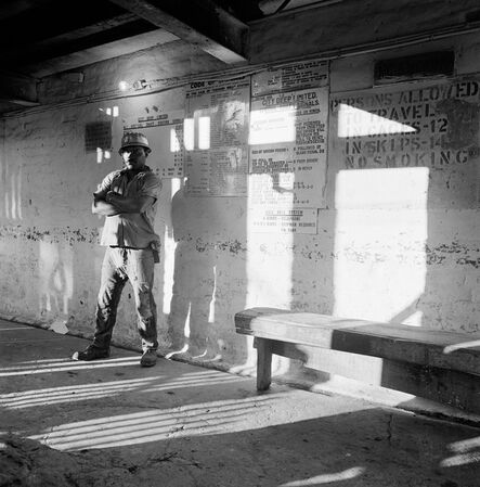 David Goldblatt, ‘A miner waits on the bank to go underground, City Deep Gold Mine’, 1966