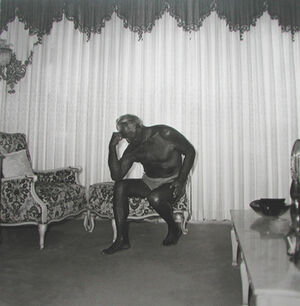 Charles Atlas seated in his Palm Beach House