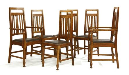 ‘A set of six Arts and Crafts oak dining chairs’