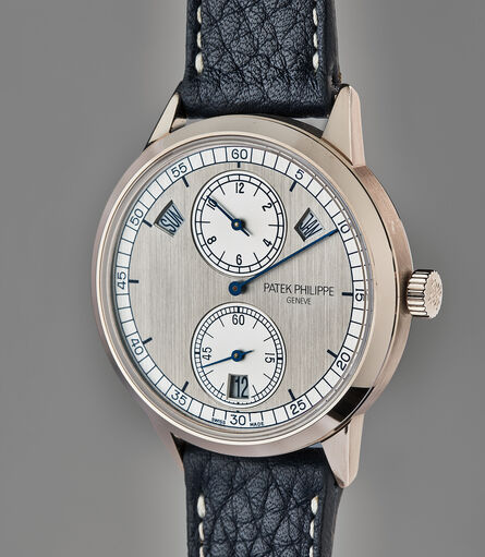 Patek Philippe, ‘A very fine and rare white gold annual calendar wristwatch with regulator-style dial, Certificate of Origin, and presentation boxes’, 2013