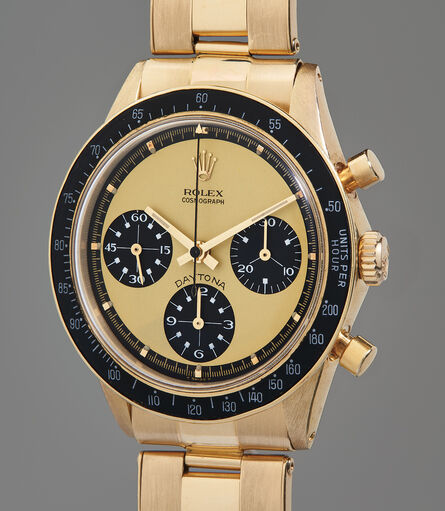 Rolex, ‘An extraordinarily rare, extremely attractive, and important yellow gold chronograph wristwatch with “Paul Newman Lemon” dial and service guarantee’, Circa 1969