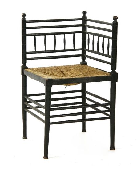 ‘An Aesthetic ebonised corner chair with a rush seat’