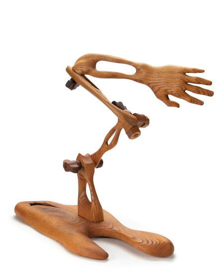 ‘A carved oak mechanical arm sculpture’
