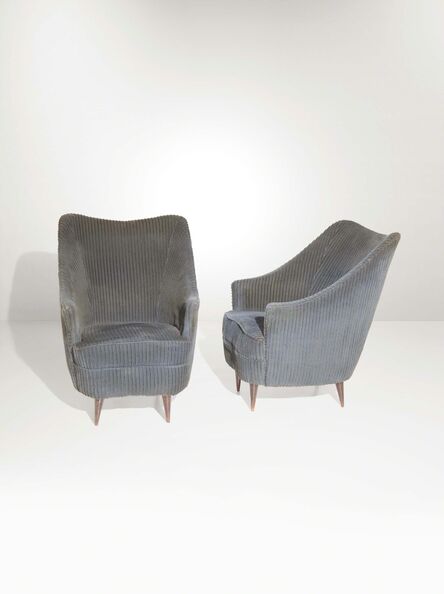 ‘A pair of armchairs with a wooden structure and fabric upholstery’, 1950 ca.
