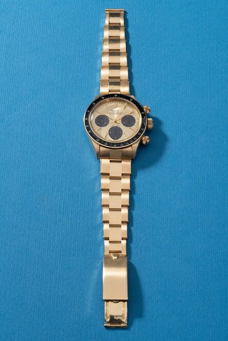 Rolex, ‘A highly attractive and very rare yellow gold chronograph wristwatch with bracelet, original guarantee, hang tag and presentation box’, Circa 1985