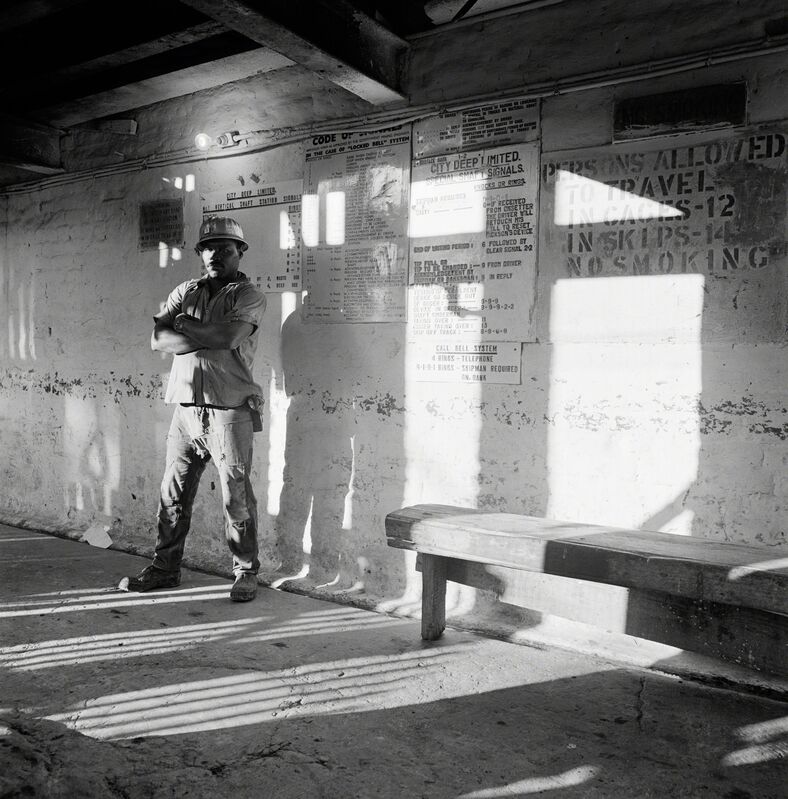 David Goldblatt, ‘A miner waits on the bank to go underground, City Deep Gold Mine’, 1966, Photography, Platinum print on Arches Platine 310gm paper, Goodman Gallery
