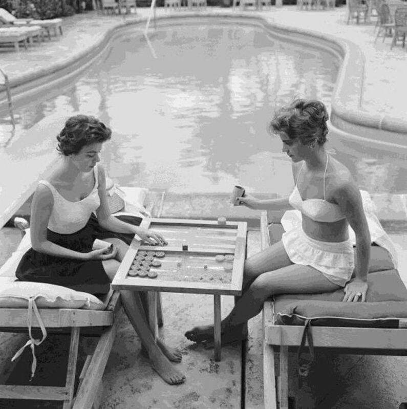 Slim Aarons, ‘Backgammon By The Pool’, 1959, Photography, Silver gelatin print, IFAC Arts