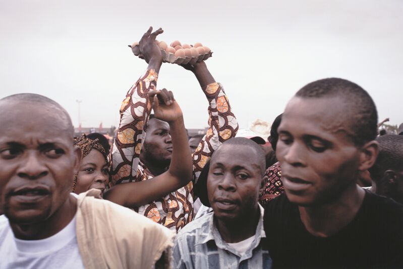 Guy Tillim, ‘Supporters of Jean-Pierre Bemba mock President Kabila, calling him an egg seller (in reference to Kabila's statement that he could not take part in early election debates because he was balancing the delicate affairs of state on his head, as an egg seller’, 2006, Photography, Inkjet print, San Francisco Museum of Modern Art (SFMOMA) 