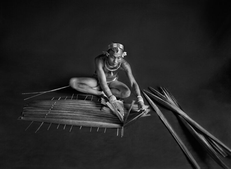 Sebastião Salgado, ‘Teureum, sikeirei (shaman), leader of the Mentawai clan, prepasring a filter for sago. Siberut Islansd.’, 2008, Photography, Gelatin silver print, Sundaram Tagore Gallery