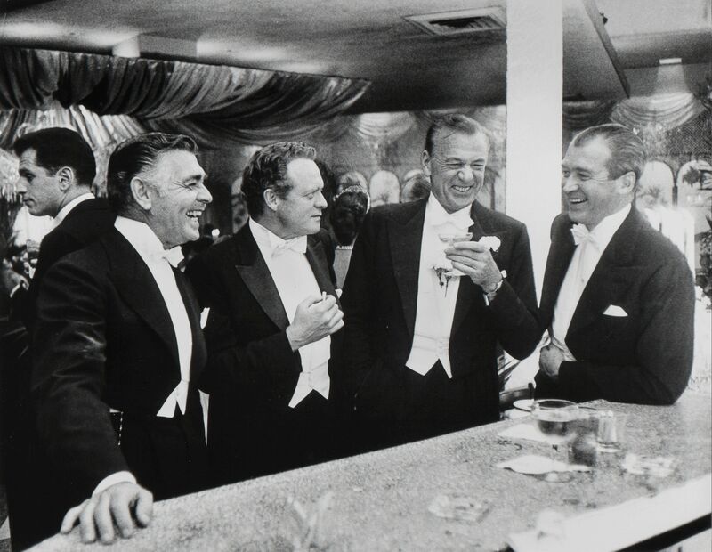 Slim Aarons, ‘Kings of Hollywood: Clark Gable, Van Heflin, Gary Cooper, and James Stewart at Romanoff's in Beverly Hills, California’, 1957, Photography, Gelatin silver, Heritage Auctions