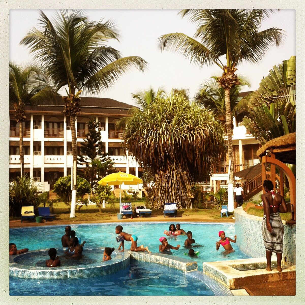 Poolside scene at a hotel in Grand-Bassam, a popular beach community outside of Abidjan, Ivory Coast. Photo by @pdicampo.