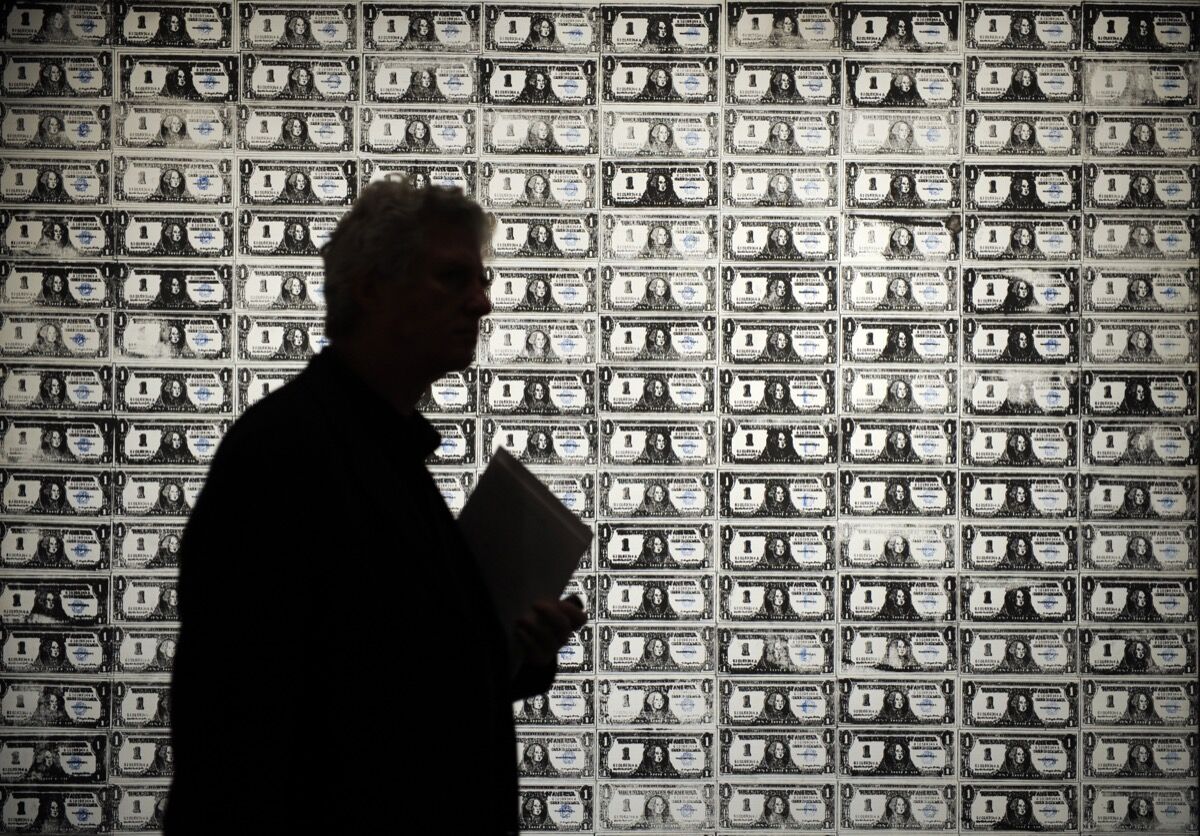 Andy Warhol, installation view of 200 One Dollar Bills, 1962. Photo by Emmanuel Dunand/AFP. Image via Getty Images.