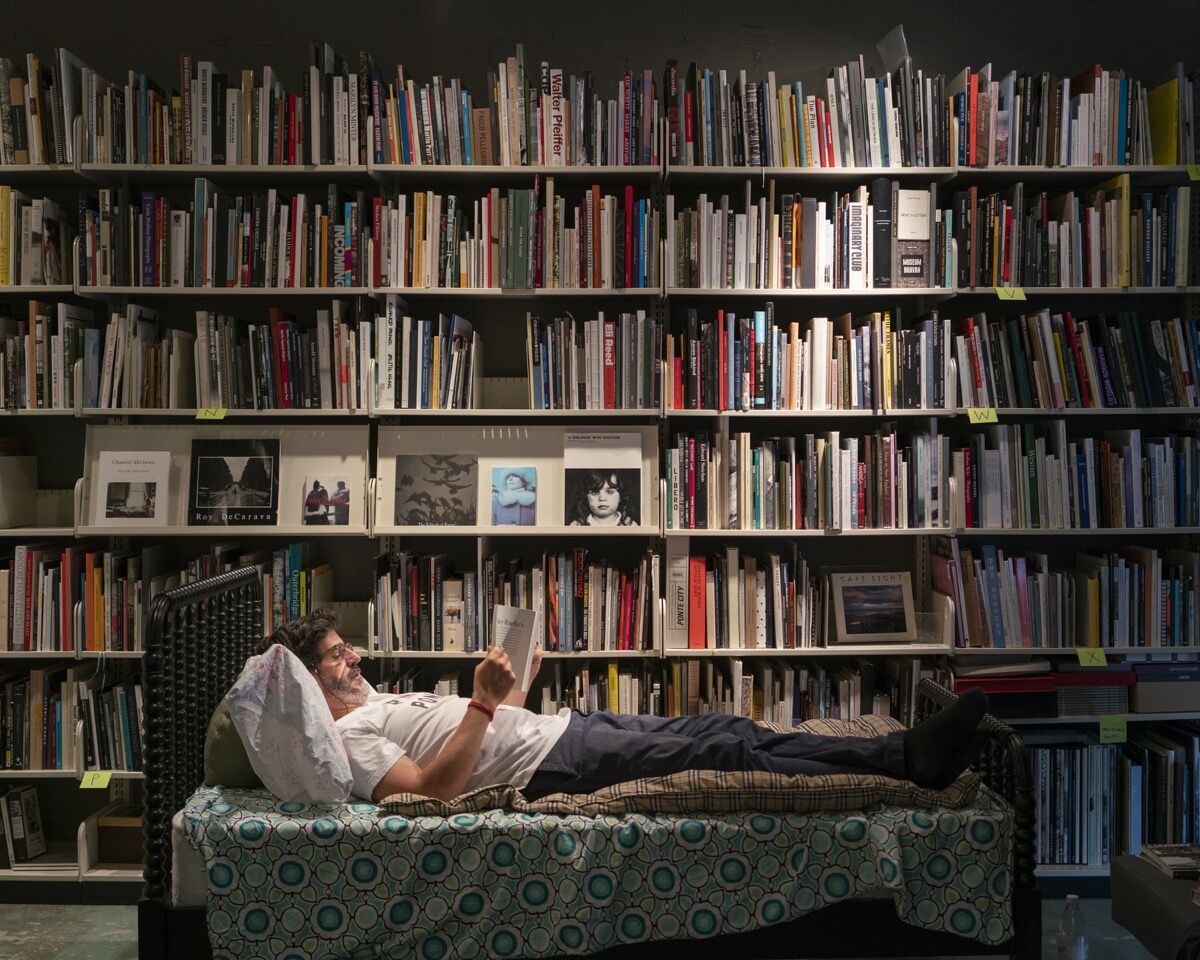 Alec Soth in his photo book library. Photo by Ethan Jones.