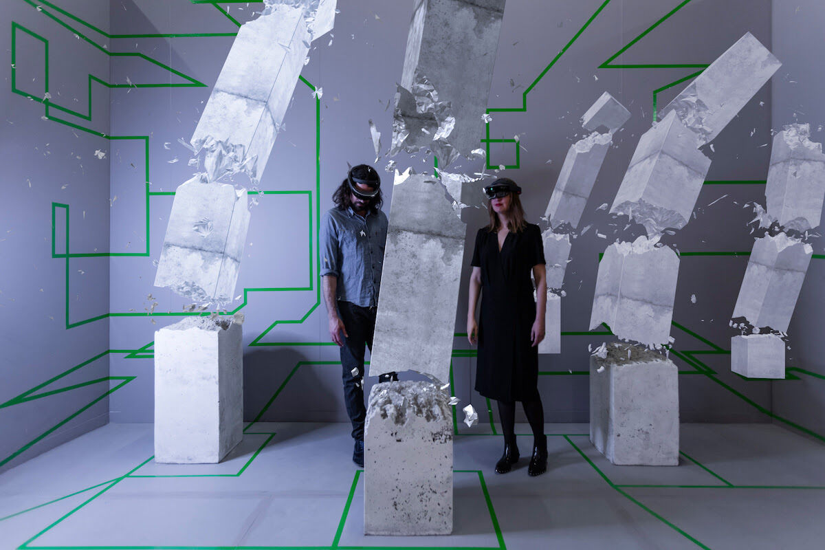 Artist duo Studio Drift inside “Concrete Storm,” their mixed reality installation at Artsy’s booth at The Armory Show 2017. Photo by Silvia Ros for Artsy.