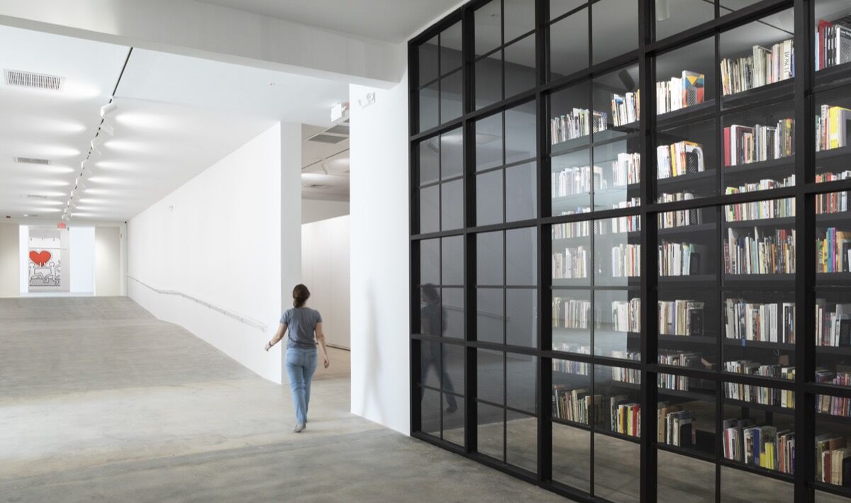 View of the Rubell Museum library, and Keith Haring, Untitled, 1981. Photo by Nicholas Venezia. Courtesy of Selldorf Architects.