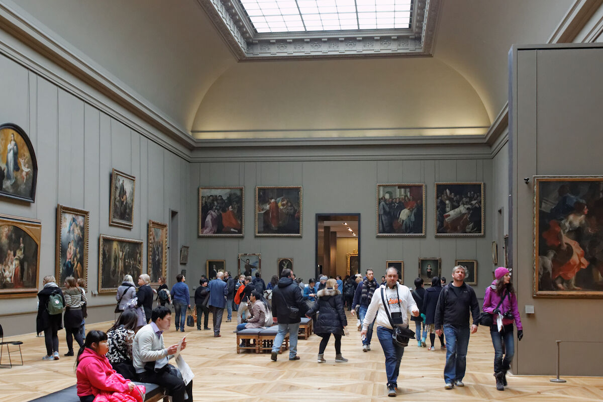 Visitors in the Spanish painting galleries at the Louvre. Photo by Coyau, via Wikimedia Commons.