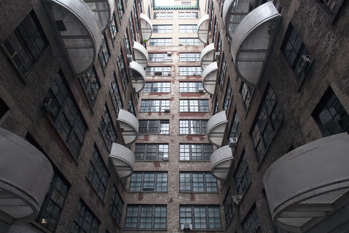 “It’s like a hive in here,” Elizabeth Gregory-Gruen said of Westbeth, a theme that recurs in the radiating fire escapes in the building’s interior courtyard. They don’t lead to the ground—in case of fire, residents are meant to crawl to a neighbor’s incombustible, concrete apartment. Photo by Frankie Alduino.