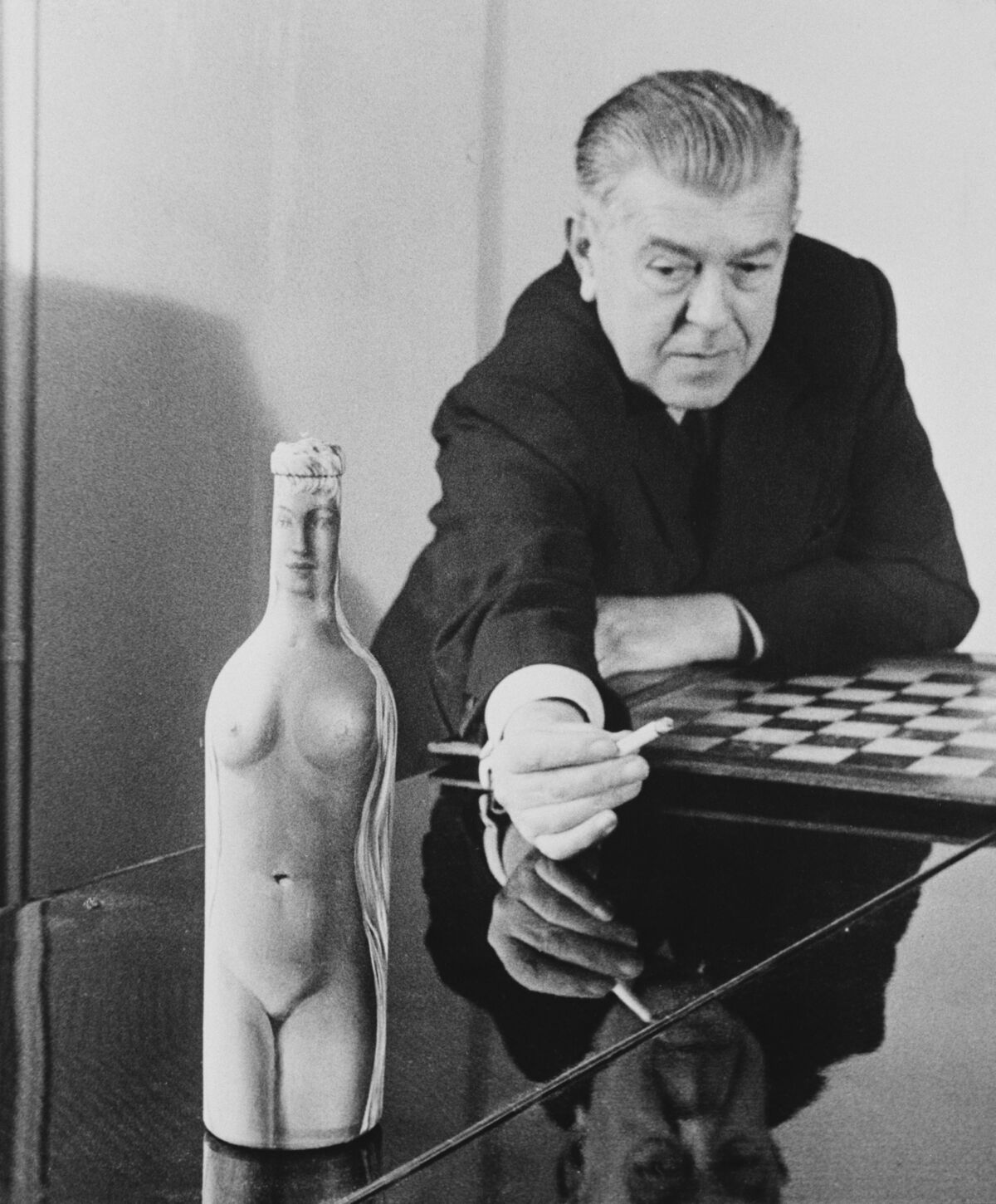 René Magritte with Femme-Bouteille, c. 1955. Photo by Archive Photos/Getty Images