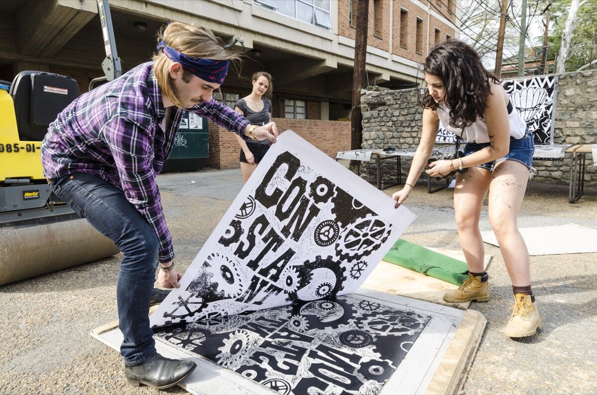 Graphic design students printing with a steamroller. Courtesy of VCUarts.