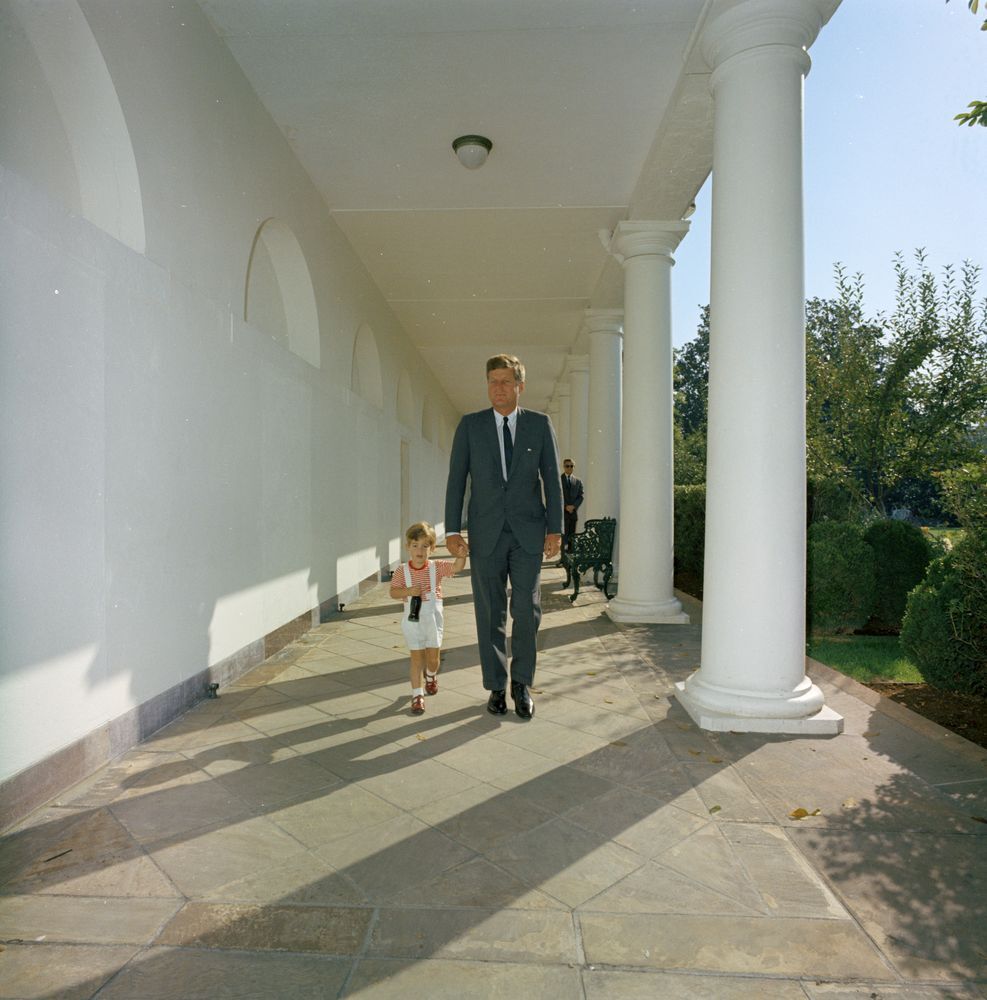 President John F. Kennedy walks with his son along the West Wing Colonnade of the White House, 19. Photo by Robert Knudsen. Courtesy of White House Photographs and the John F. Kennedy Presidential Library and Museum, Boston.