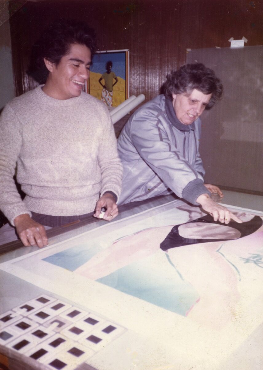 Sister Karen reviewing a serigraph with an artist in the Professional Printmaking Program. Courtesy of Self Help Graphics &amp; Art.