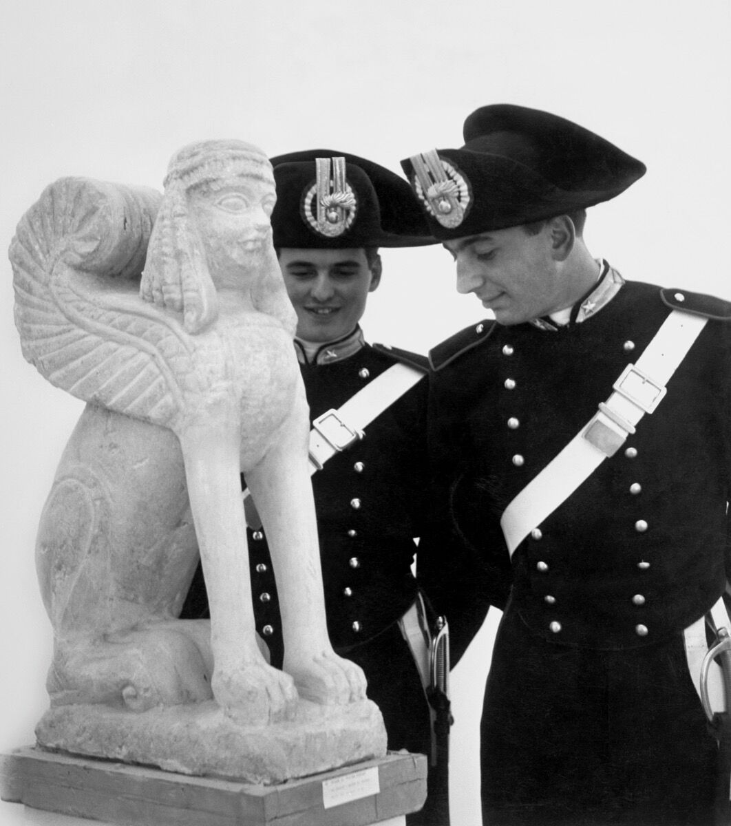 Italian Police in an exhibition with an Etruscan work, 1955.Photo by Touring Club Italiano/Marka/Universal Images.Group via Getty Images.