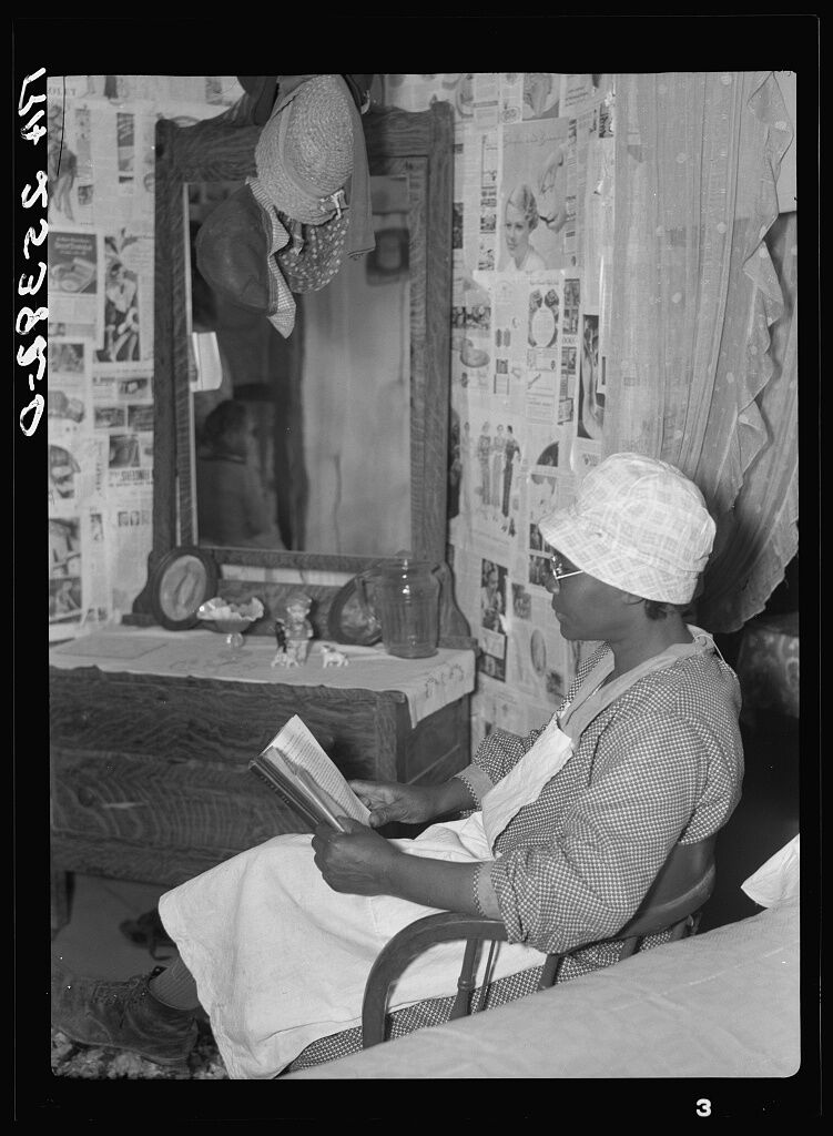 Quilter Jorena Pettway reading in her room, 1937. Photo by Arthur Rothstein. Courtesy of the Library of Congress. 