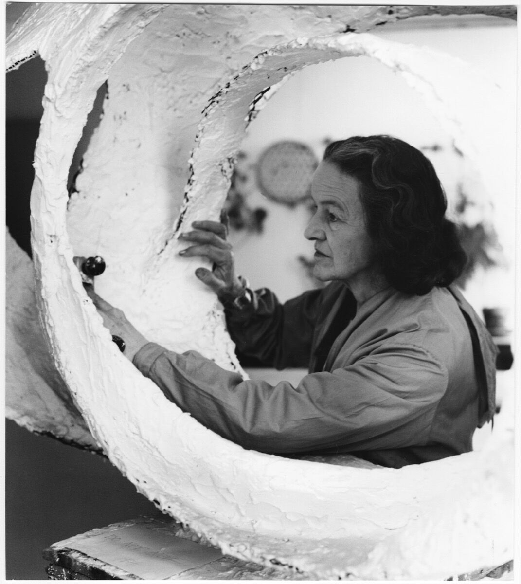 Barbara Hepworth at work on the plaster for Oval Form (“Trezion”), 1963. Photo by Val Wilmer. © Bowness, Hepworth Estate. Courtesy of the Hepworth Wakefield.