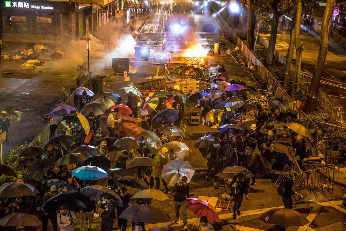 Police and protesters clash near Hong Kong Polytechnic University in Hung Hom district of Hong Kong on November 18, 2019. Photo by Dale De La Ray/AFP via Getty Images.