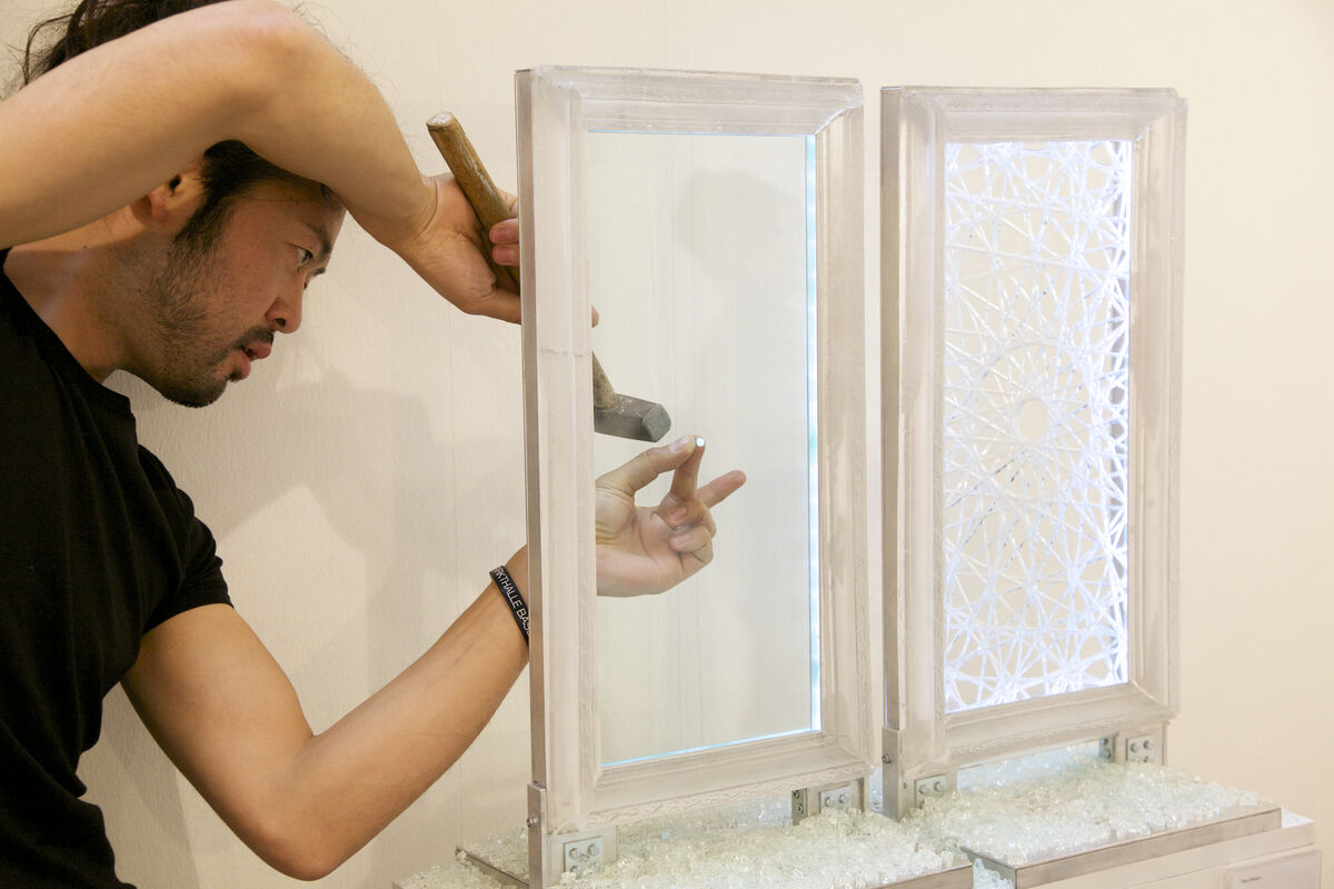 Tets Ohnari (exhibiting with Tezukayama Gallery, Osaka) sets up his performance action blink, which in an instant will crack the glass pane to “activate” and complete the piece; Courtesy VOLTA13