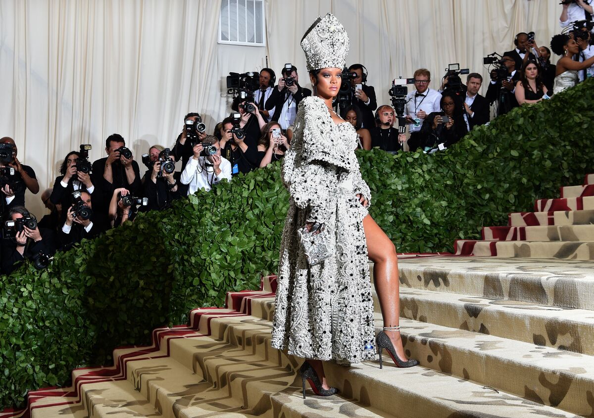 Rihanna arrives for the 2018 Met Gala on May 7, 2018, at the Metropolitan Museum of Art in New York. The Gala's 2018 theme is “Heavenly Bodies: Fashion and the Catholic Imagination.” Photo by Hector Retamal/AFP/Getty Images.