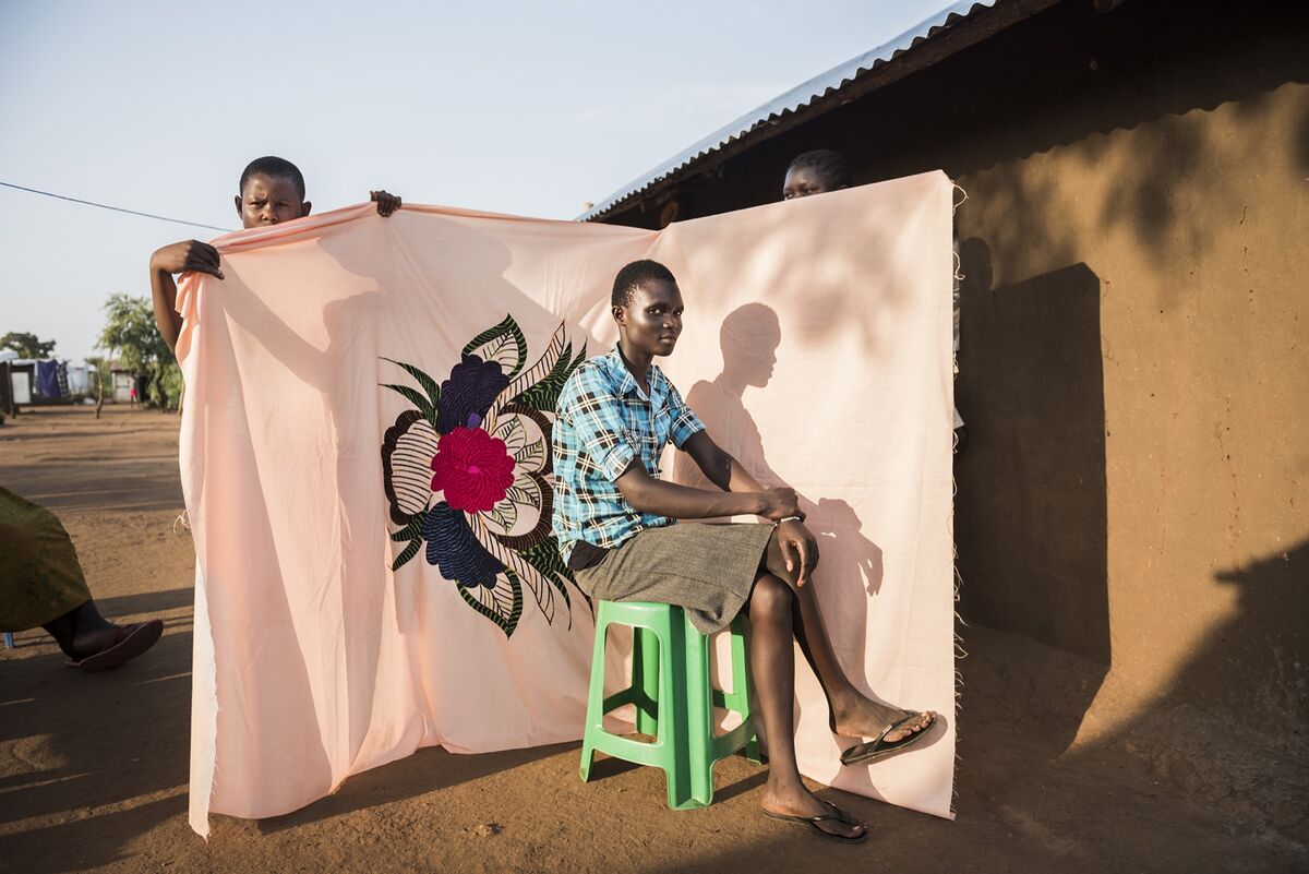 Irene Sonia, 17, wants to become a bank accountant, but in Bidibidi refugee camp they do not have the right subjects in school. Her mother, Esther, has been fighting for better education in the refugee settlements to provide their kids with a better future when the war in South Sudan is over. Photo by Nora Lorek. Courtesy of the artist.