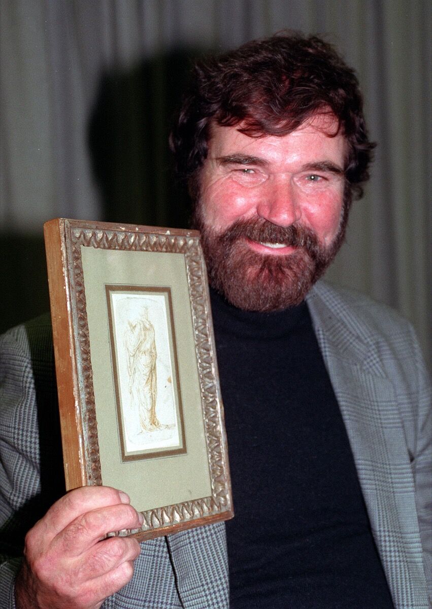 Artist Eric Hebborn with his original drawing in the manner of 15th century artist, Fra Bartolomeo. Photo by Tim Ockenden - PA Images/PA Images via Getty Images.