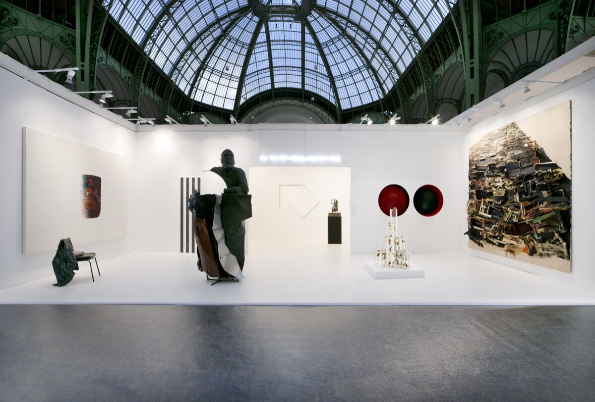 Installation view of Kamel Mennour's booth at FIAC 2019, Paris. © The artists (from left to right) : ADAGP Lee Ufan, ADAGP Tatiana Trouvé, ADAGP Daniel Buren, ADAGP Mohamed Bourouissa, Douglas Gordon / Studio lost but found / VG Bild - Kunst, Bonn 2019 , ADAGP François Morellet, ADAGP Camille Henrot, Alicja Kwade, ADAGP Anish Kapoor, Tadashi Kawamata Photo. Courtesy of the artists, Studio Morellet, and Kamel Mennour, Paris/London.