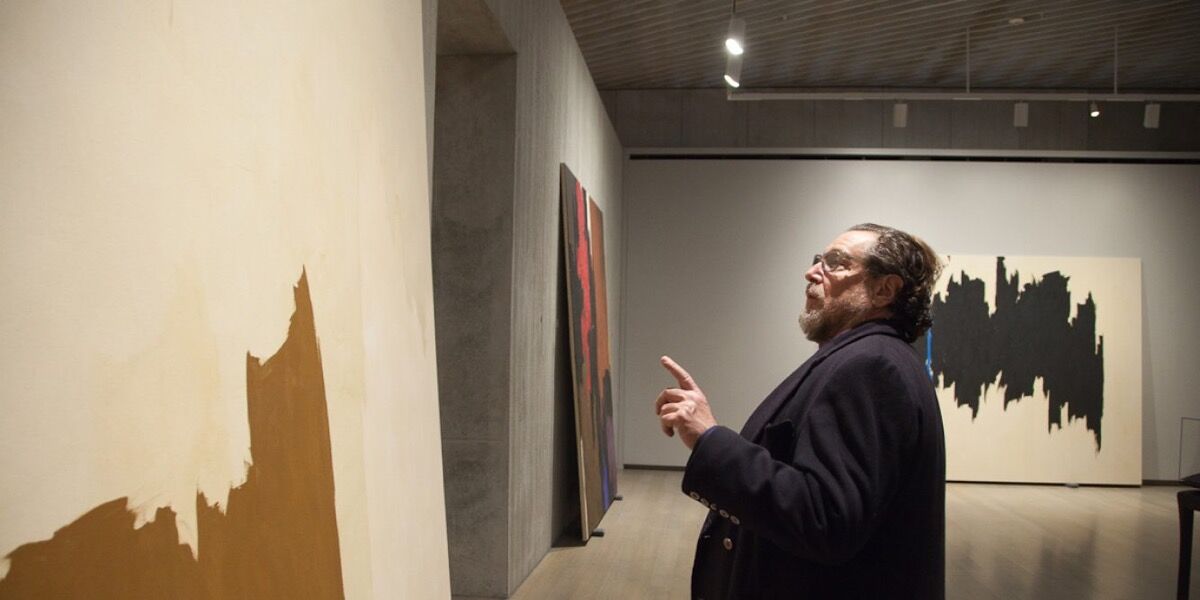 Julian Schnabel working at the Clyfford Still Museum, 2017. Photo by Justin Wambold.