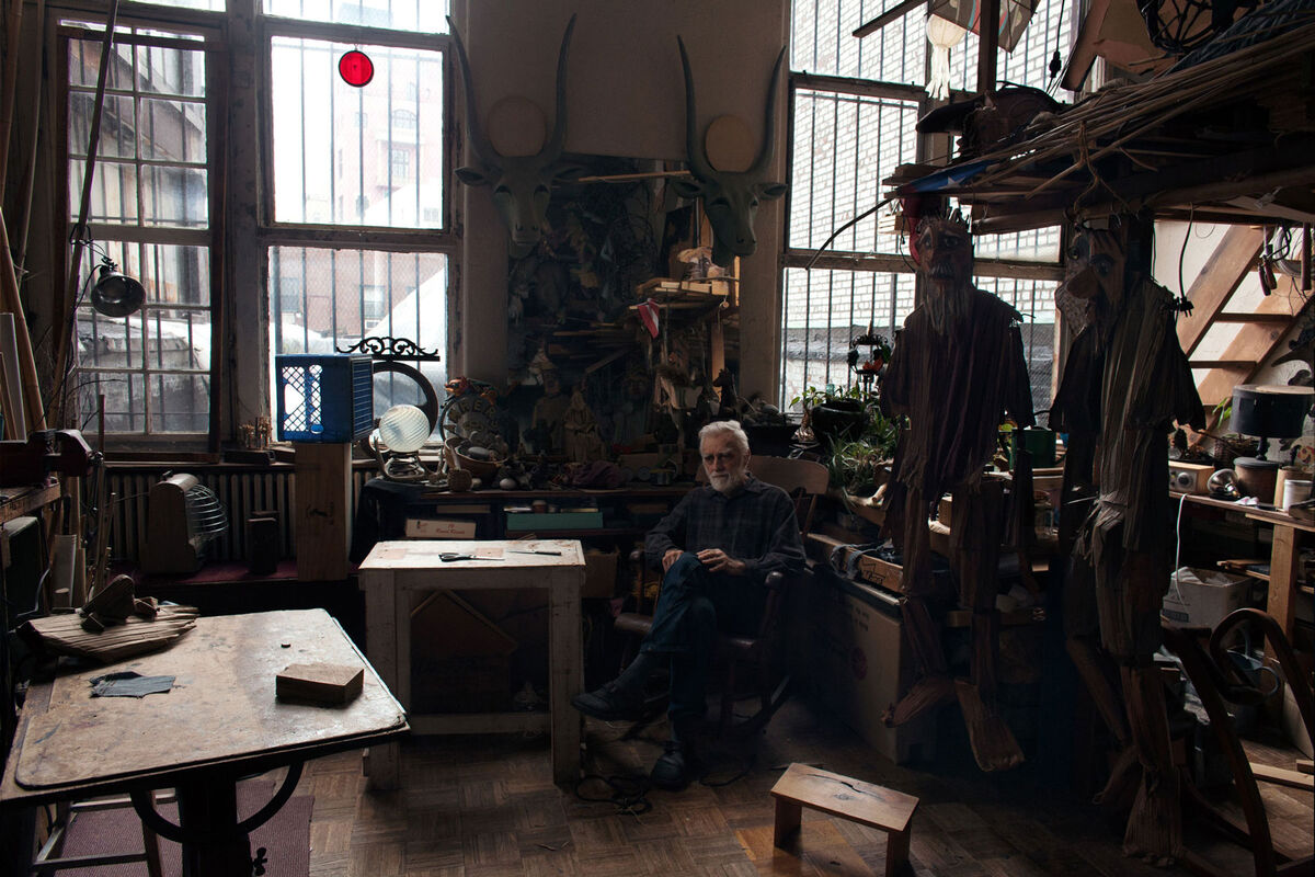 Theater artist Ralph Lee, 83, loves spending time in his studio located in the apartment he moved into with his wife and three children in 1970. He curates a rotating array of his fantastical puppets in an unused guard booth in the Westbeth courtyard. Photo by Frankie Alduino.