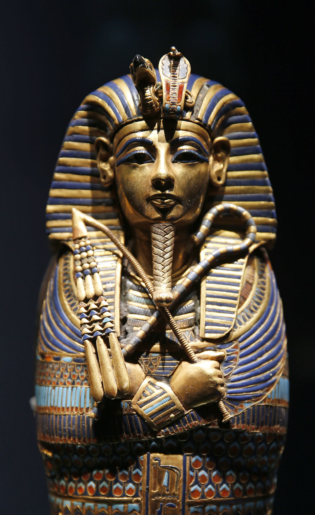 Coffinette of Tutankhamen dedicated to Imseti and Isis is displayed during the “Tutankhamun: Treasures of the Golden Pharaoh” exhibition held at the Grande Halle of La Villette. Photo by Chesnot/Getty Images.