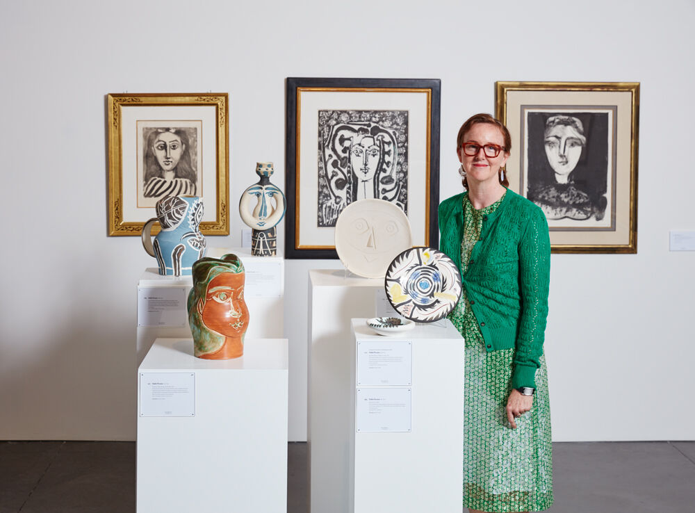 Kelly Troester seen here with a grouping of Pablo Picasso ceramics and prints