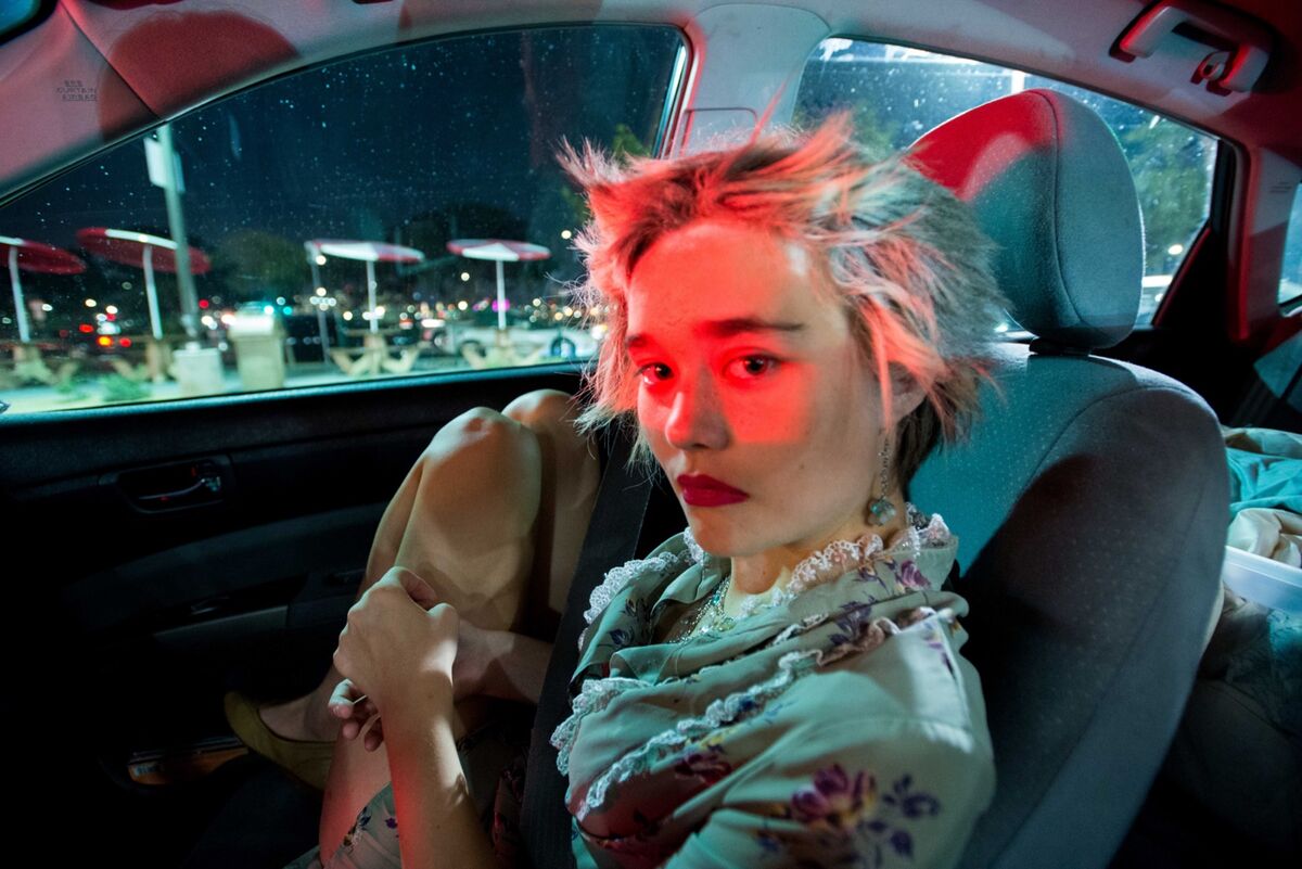 Kat, 16, in a drive-thru on Halloween night. “She checked her phone and started to cry but wouldn’t tell me why,” Bottoms said. “All I could do was sit there and comfort her. I asked if I could take her photo. She said yes and looked right at me. Sometimes her resistance to communicate is hard.” From Bottoms’s ongoing story about the relationship between her mother and Kat, who has autism and prodromal schizophrenia. Photo by September Dawn Bottoms. Courtesy of the artist.