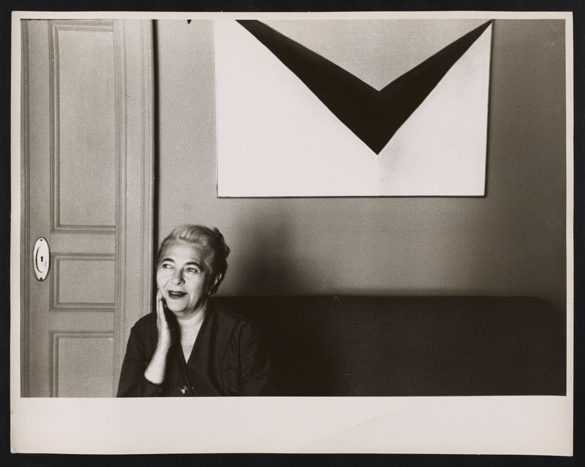Edith Halpert in 1955 with Georgia O&#x27;Keeffe&#x27;s In the Patio IX, one of the prizes of her personal collection. Courtesy of the Jewish Museum.  