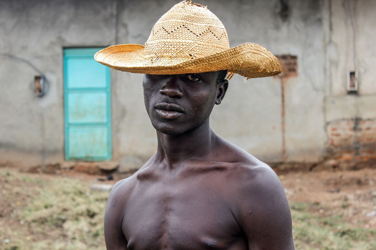 A homeless man poses for a portrait in Mbale, Uganda, on July 24, 2015. Mbale District has a high rate of homeless children, and access to clean water, food, medical services, and education are often lacking. Photo by Esther Ruth Mbabazi. Courtesy of the artist.