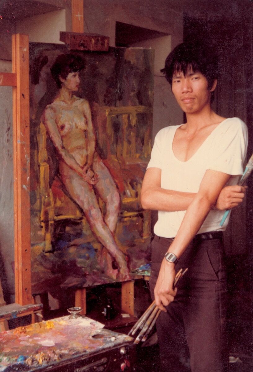 Portrait of Cai Guo-Qiang with his oil painting in China in 1983. Courtesy of Cai Studio.