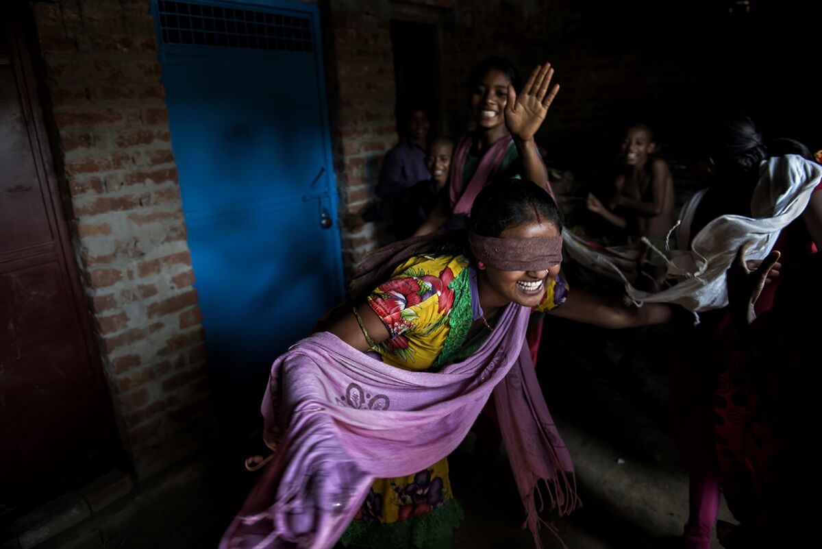 Nirma, 16, plays with her friends and cousins in Shravasti, Uttar Pradesh, India. Nirma is married to Rakesh from a nearby village. Photo by Saumya Khandelwal. Courtesy of the artist.