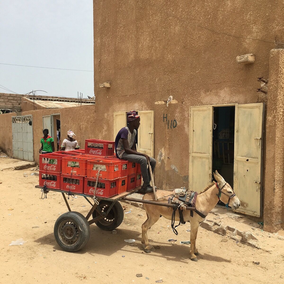 Aziz makes Coca-Cola deliveries with his donkey in Nouakchott, Mauritania. Photo by @dcoreraphotography.