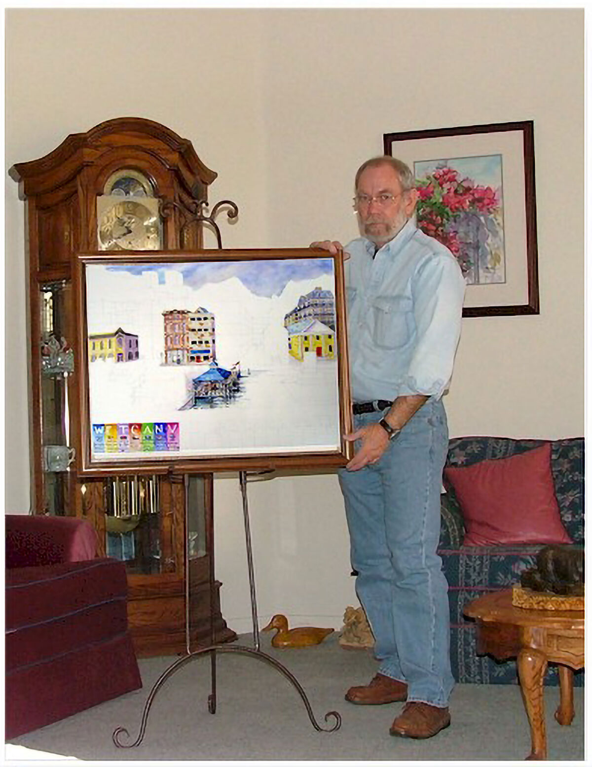 WetCanvas members around the world pose with a collaborative painting featuring architectural scenes from different countries represented in the online community, c. 2004. Courtesy of Scott Burkett.
