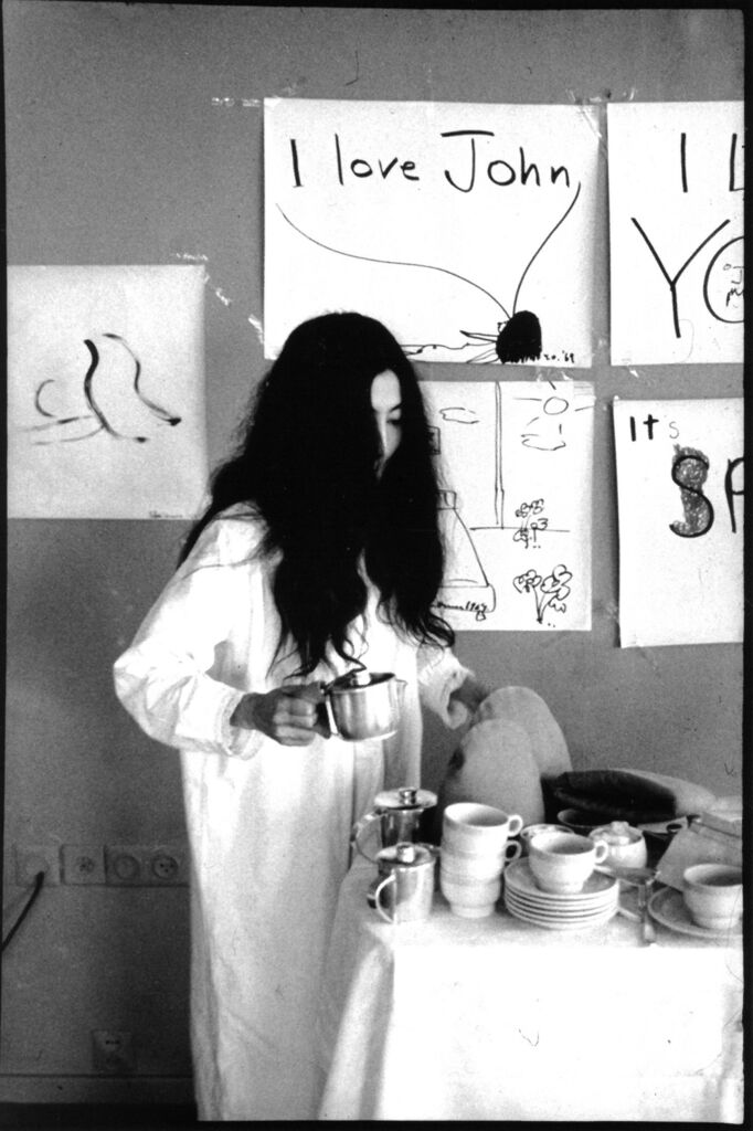 Yoko serving coffee to the photographer after the press conference for Bed in for Peace in Amsterdam’s Hilton hotel, where the couple and the photographer were staying